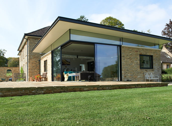 Modern home with a custom steel-framed glazed extension, designed and fabricated by Riteweld Engineering