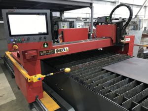 CNC plasma cutting machine in operation at Riteweld Engineering, precisely cutting a steel sheet with digital controls and high-accuracy technology.