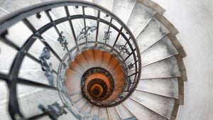Top-down view of a bespoke steel spiral staircase with decorative balustrades, designed and installed by Riteweld Engineering for a project in Oxfordshire.